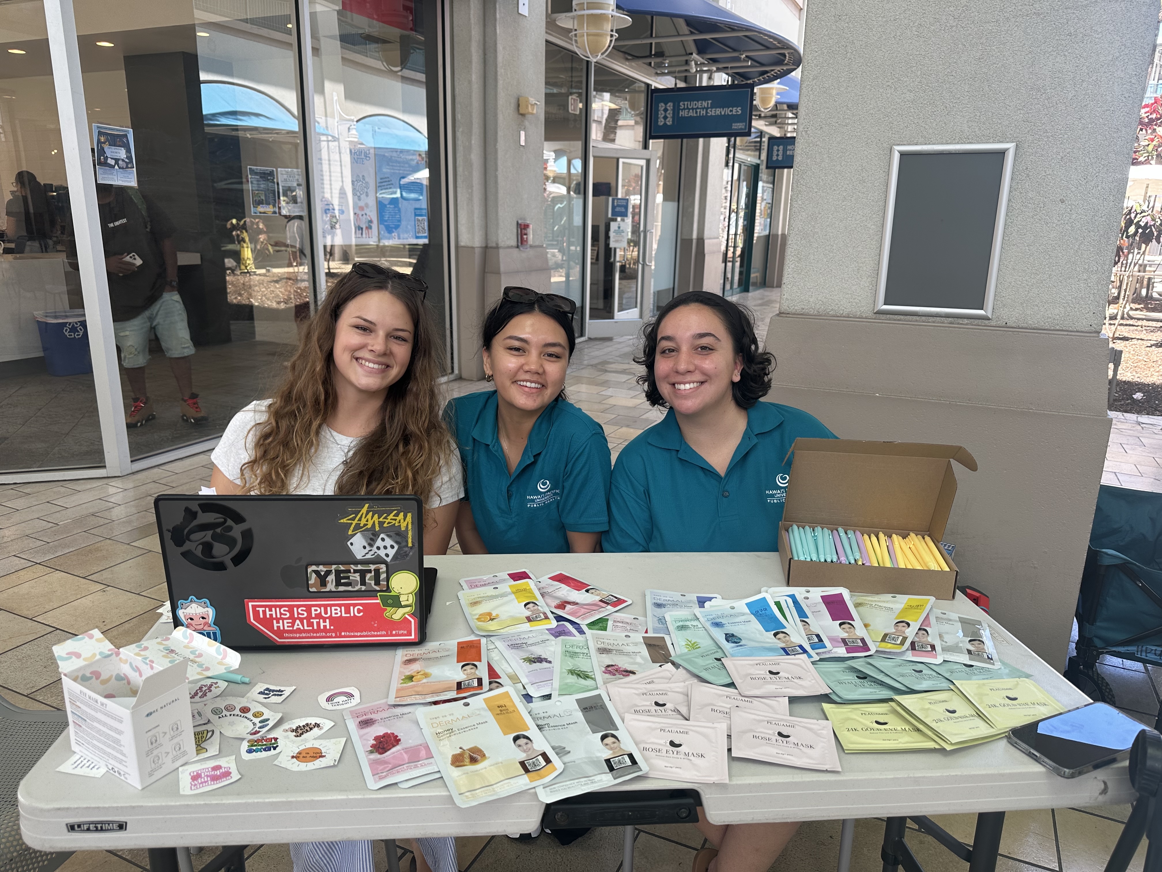 MPH students doing outreach at a wellness event